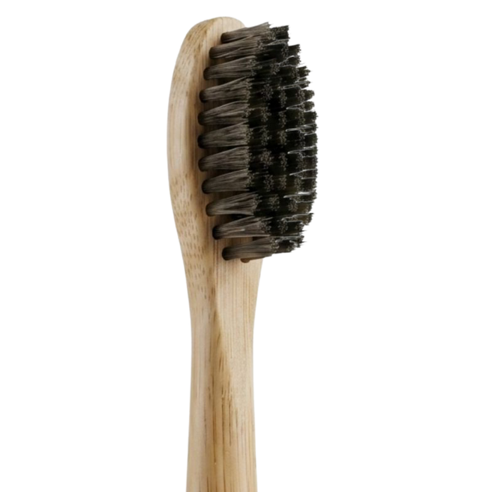PRIMALS electric toothbrush head with natural dark-colored horse bristles on a bamboo handle.