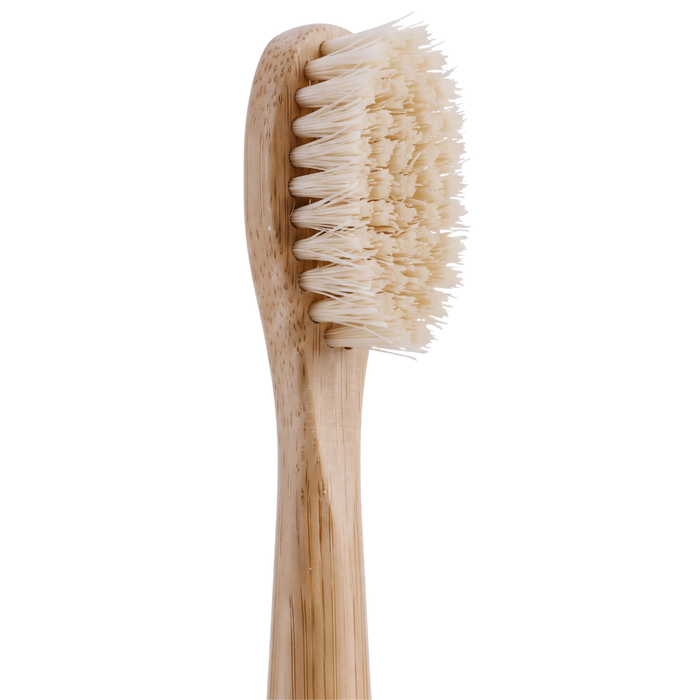 PRIMALS electric toothbrush head with natural cream-colored boar bristles on a bamboo handle.